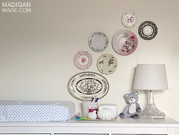 use a dresser as a changing table for a nursery (love the vintage plate wall, too)