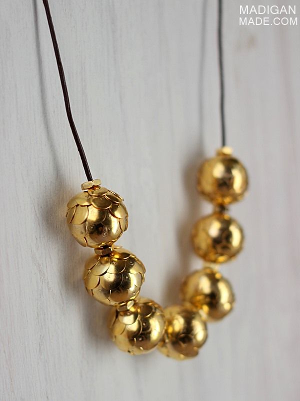 Simple necklace made from gold thumtacks and brass hardware - gorgeous!