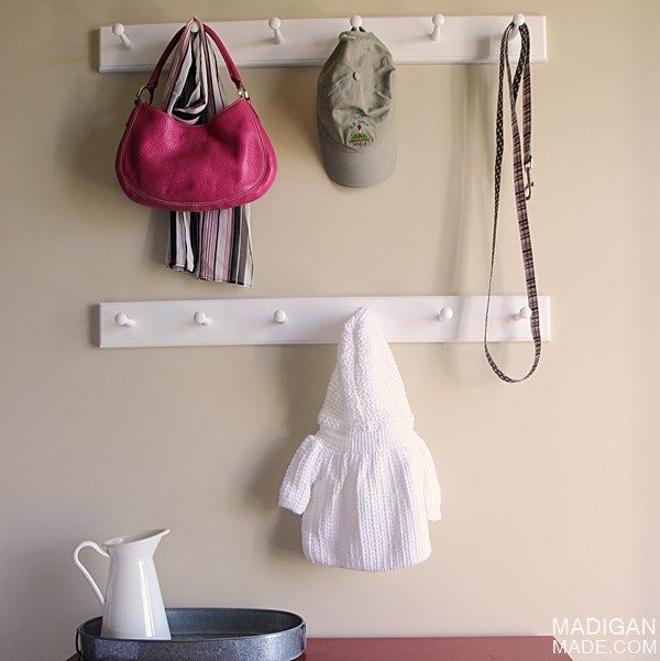 Simple (and stylish) updates for a functional foyer (love the shaker peg hooks!)