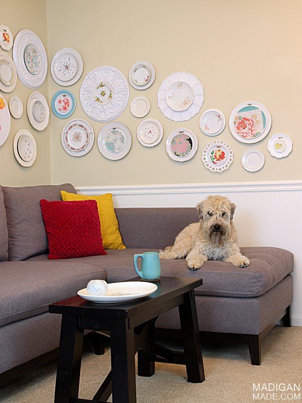 DIY wall art made with vintage plates, fabric, hoops and ceiling medallions