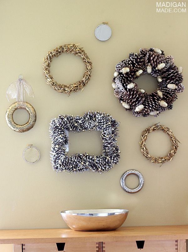 Hang a bunch of gold and silver wreaths on the wall for easy decor