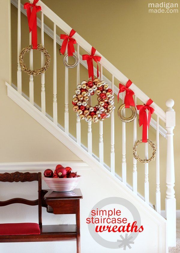 Simple idea: Hang wreaths down the stairs - part of the holiday home tour at madiganmade.com
