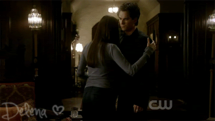Damon and Elena hug.